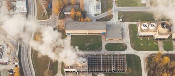 white smoking coming out of industrial building